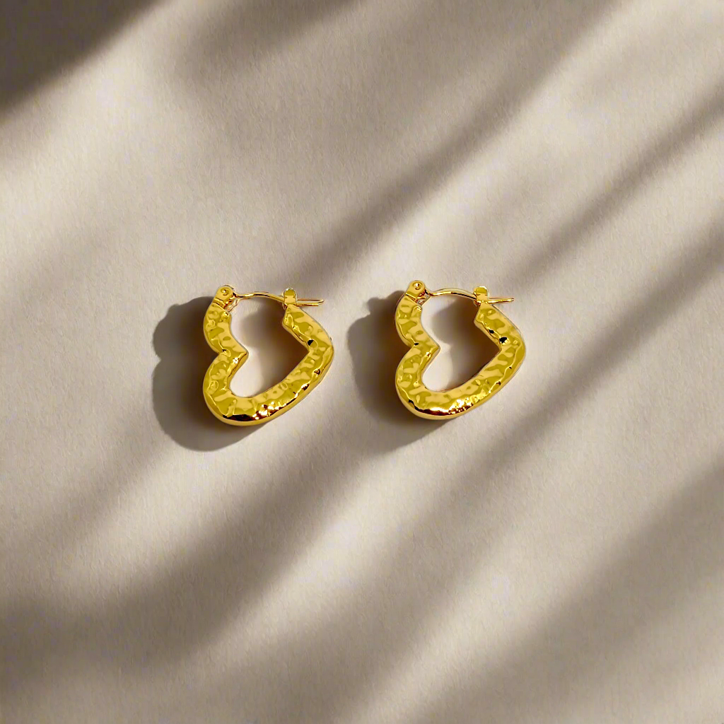 Gold hoop earrings on a white background