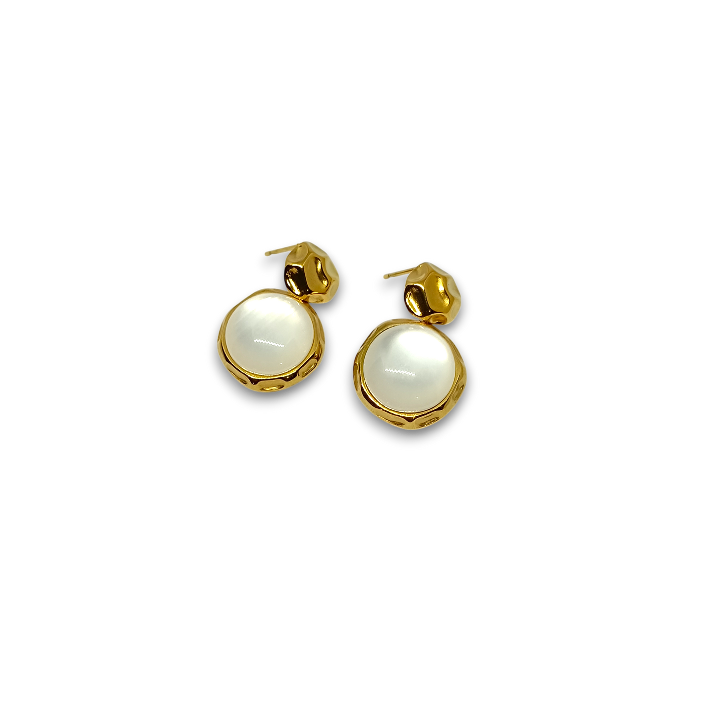 Golden earrings with white round stones on a white background