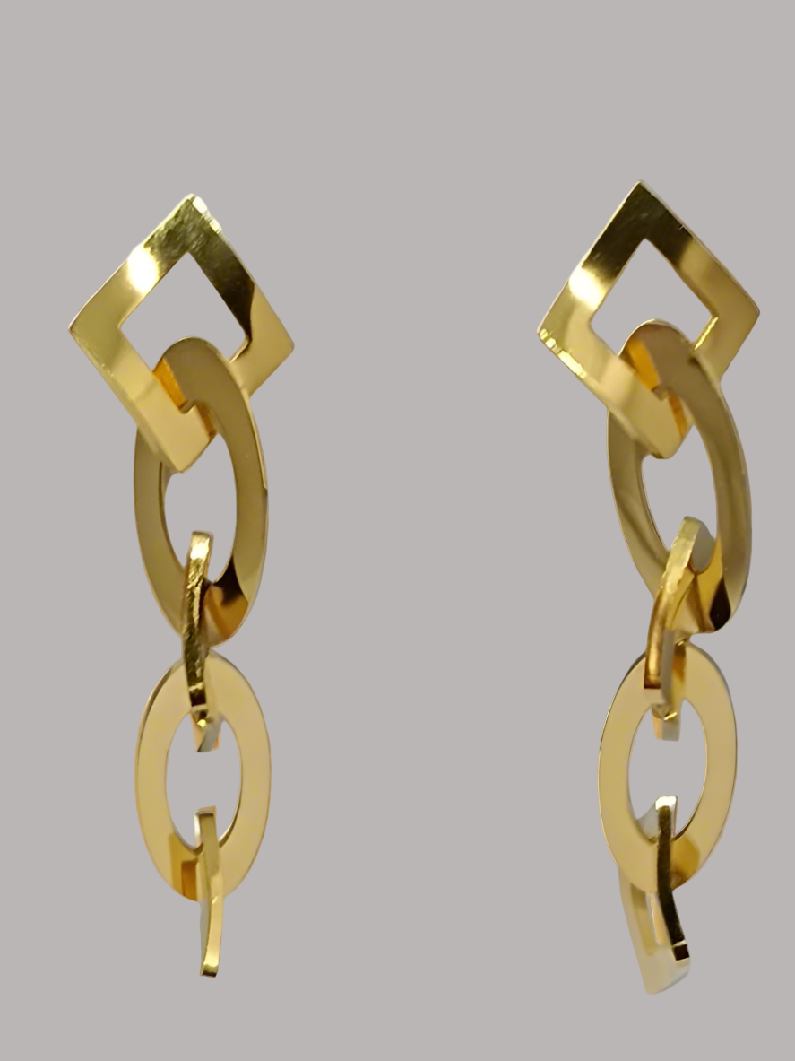 Gold chain-style earrings on a light background