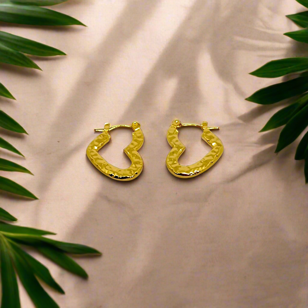 Gold hoop earrings on a white background