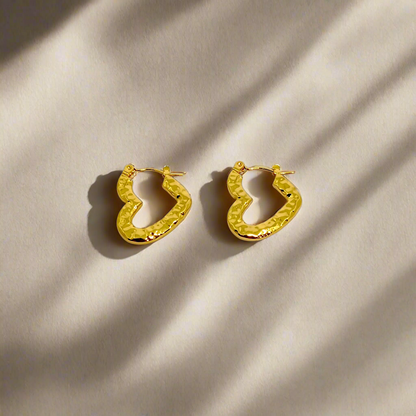 Gold hoop earrings on a white background