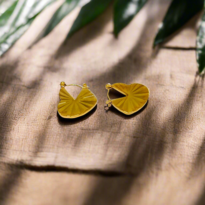 Gold hoop earrings on a white background