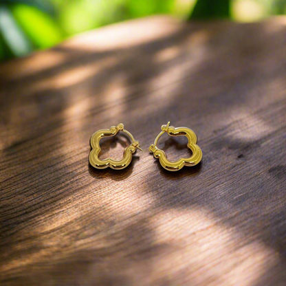 Gold hoop earrings on a white background