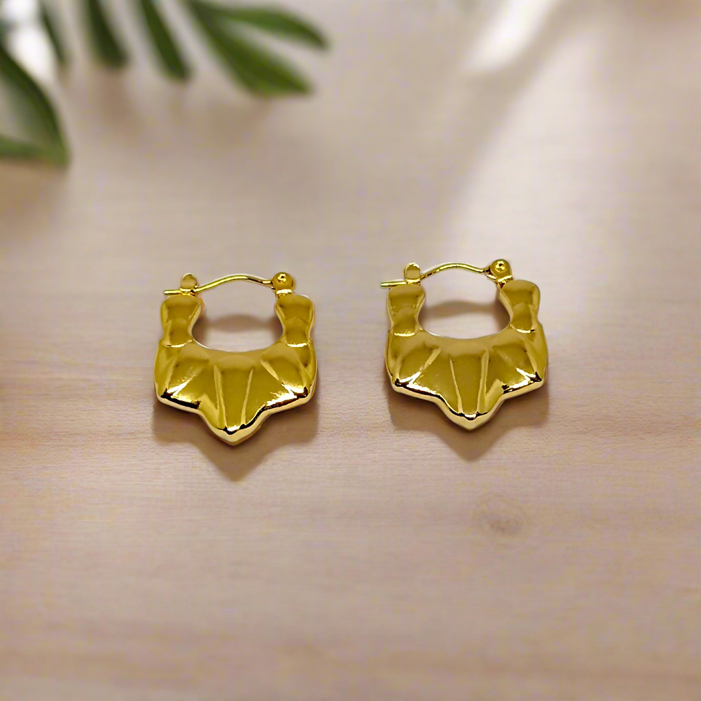 Gold hoop earrings on a white background