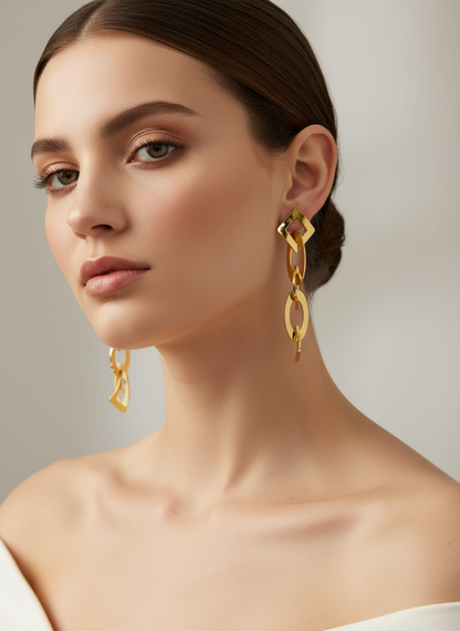 Woman wearing golden earrings with a neutral background