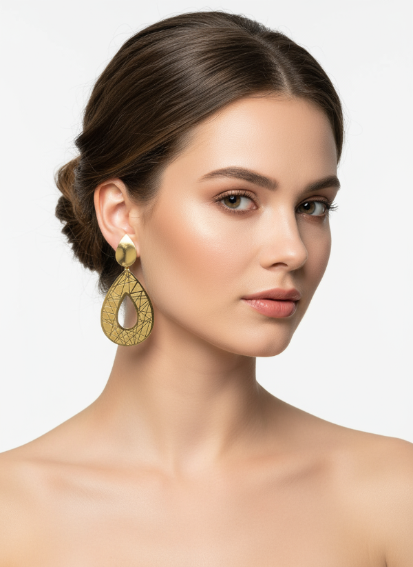 Gold teardrop earrings on a white card with a light gray background