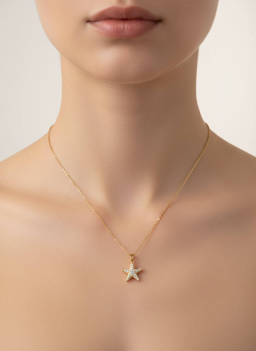 Star pendant necklace on a model against a neutral background
