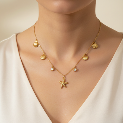 Golden necklace with starfish pendant on a model