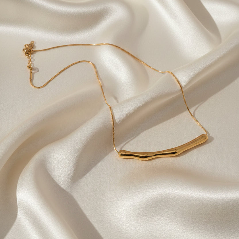 Golden necklace on a white background